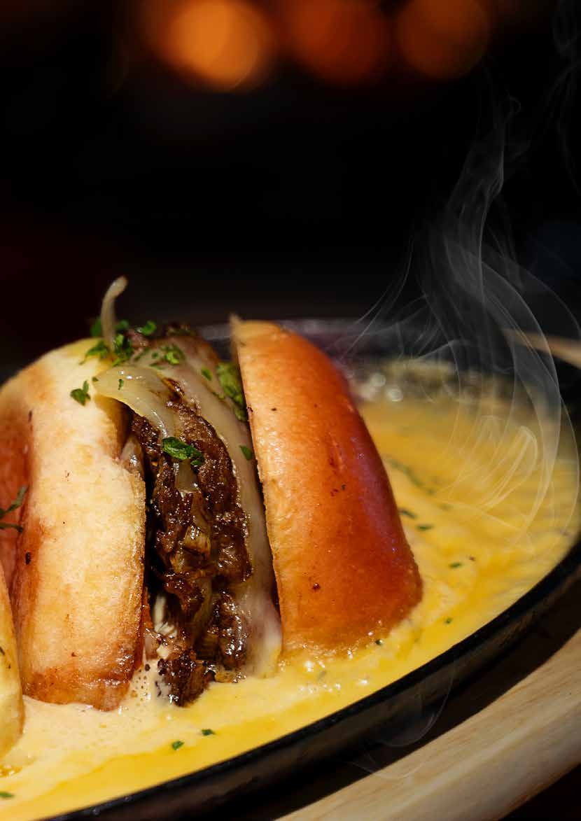 Earle’s Bussin’ Burger served with sizzling cheese